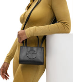 Telfar small shopping bag embossed logo closeup