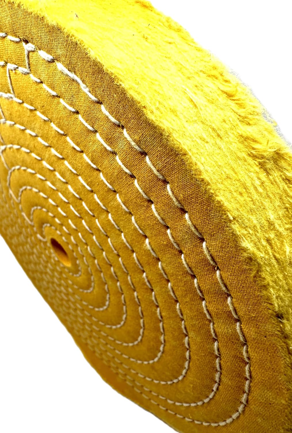 Pro-Graad medium yellow metal buffing wheel mounted for application