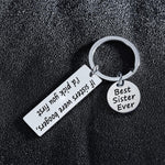 Lifestyle representation of the funny sister gift keyring prepared for gifting.