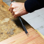 Side angle of the professional woodworking chisel showing profile thickness