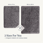 Belador bath rug set placed neatly outside a glass shower door