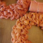 Rustic wedding decoration featuring yellow burlap ribbon