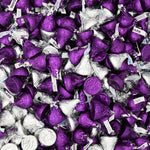 Assorted milk and dark chocolate confectionery elements displayed out of the packaging.