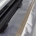 Nesco vacuum sealer open lid showing built in roll storage and cutter