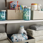 Organized household containers labeled with DYMO paper tape