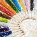Vibrant candy buffet rock candy sticks in blue raspberry and watermelon flavors.