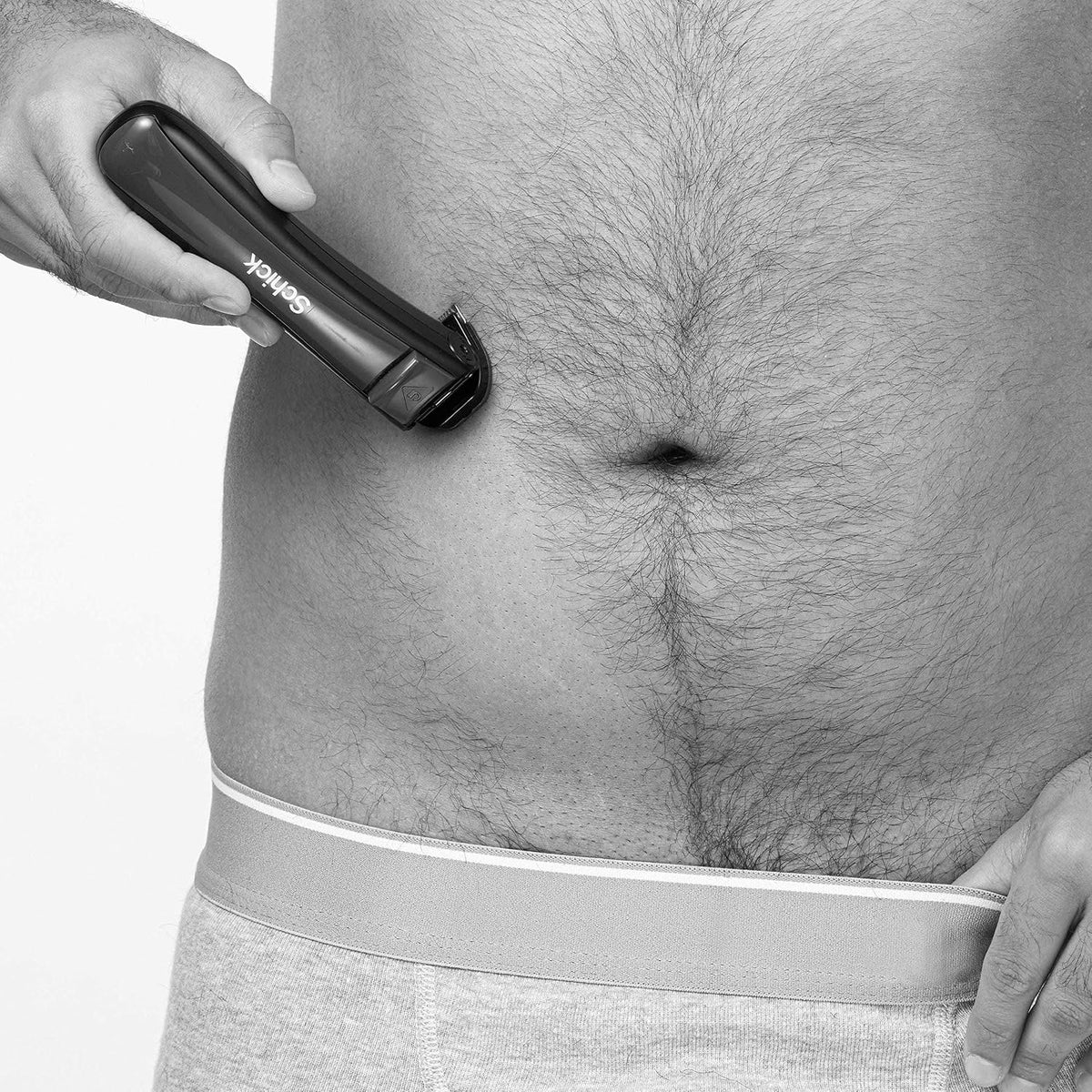 Schick grooming device shown in waterproof shower setting
