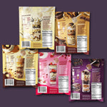 Side view of FlavCity single serve protein packets highlighting gluten-free and non-GMO certifications.