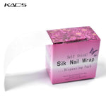 KADS nail wrap system being applied to a clean natural nail for reinforcement.