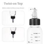 Leak proof adjustable twist cap nozzle detail on a clear hair color bottle.