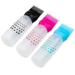 Demonstration of squeezing the flexible plastic bottle to show smooth liquid flow through the comb tip.