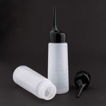Close up view of the black slanted tip nozzle on the Yebeauty hair color bottle