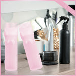 Two pack bundle of the pink BLAAROOM hair coloring and oiling applicator tools resting on a clean surface.