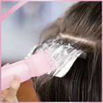 Disassembled view of the reusable pink hair dye bottle showcasing the wide neck opening and detached comb attachment.