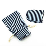 Folded Holiberty travel slippers inside travel storage bag