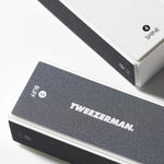 Tweezerman 4-sided nail buffer block showing color coded surfaces