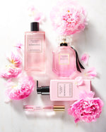 Victoria's Secret Bombshell standard 1.7 Ounce liquid volume size bottle held to demonstrate scale and design.