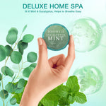 Close up look of organic eucalyptus and mint leaves alongside an opened aromatherapy steamer package