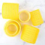 Close up view of the yellow self grip material on the Drybar hair rollers.
