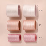 A blow dryer being used over the ceramic core rollers to activate even heat distribution