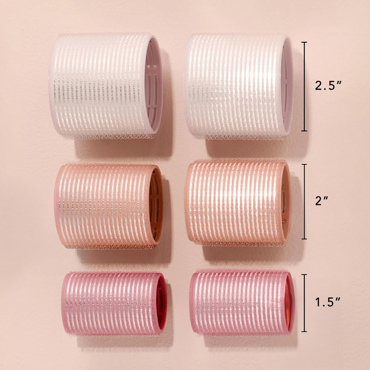 A blow dryer being used over the ceramic core rollers to activate even heat distribution