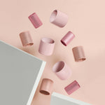 The complete nine piece hair roller kit displaying the variance in sizing for custom styles