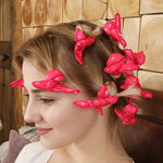 Thirty pieces of pink foam rollers for long hair neatly arranged for styling.