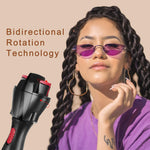 Black electronic hair twister tool showing the dual hairpin clips close up