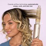 Shark paddle brush attachment used for detangling and smoothing long hair efficiently