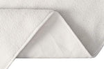 Side view of heating pad showing thick fleece construction
