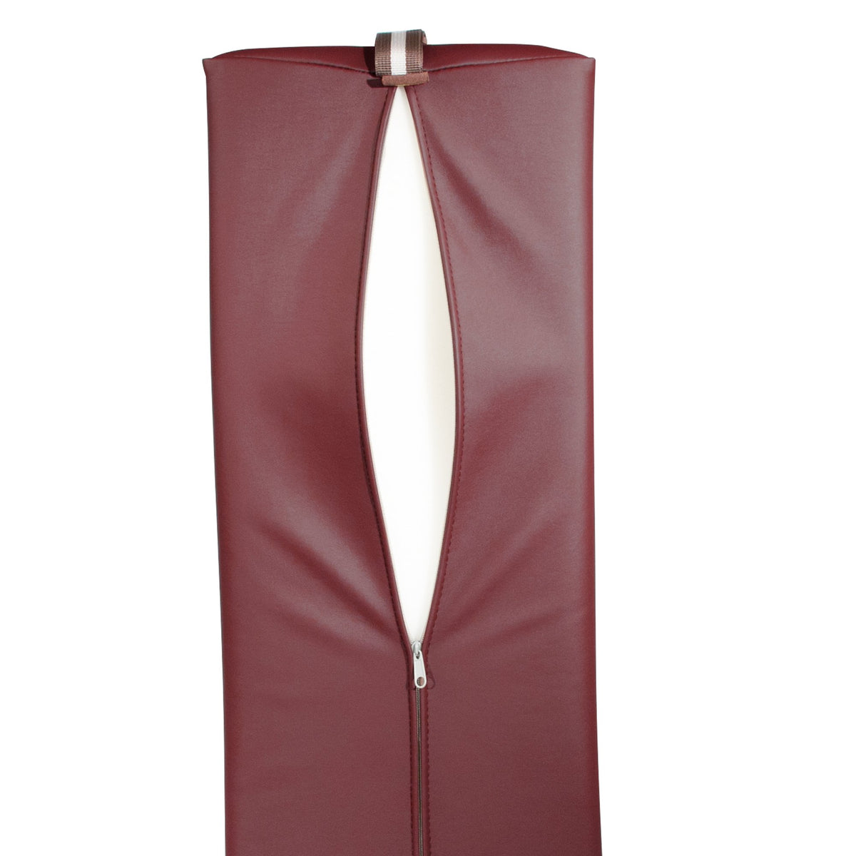 Massage therapist using 9 inch burgundy bolster on table