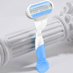 Two pieces of ergonomic women's razor replacement handles displaying the non slip rubber surface design.