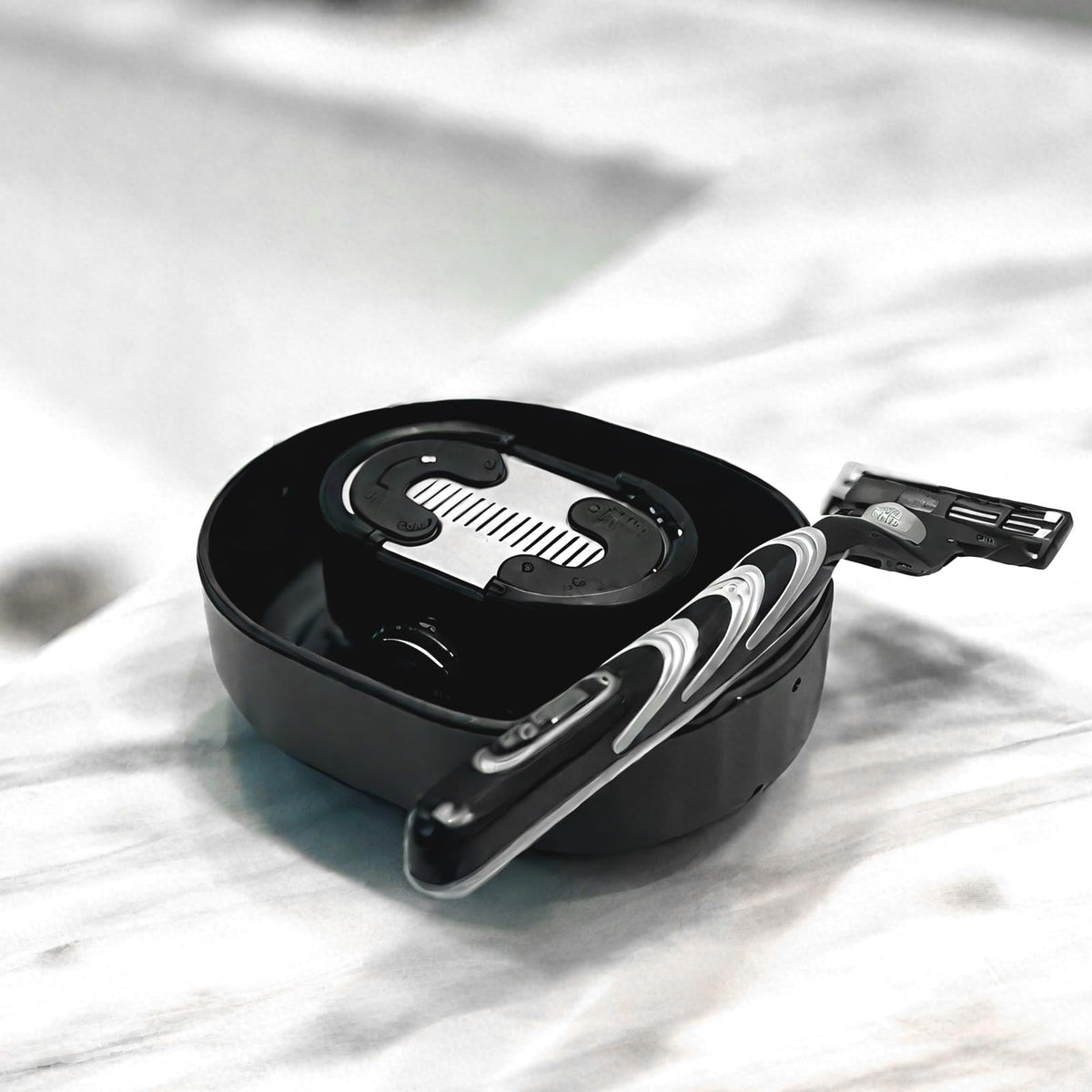 Eco friendly battery free shaver blade cleaner showcasing its lightweight portable design.