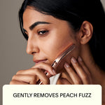 Leaf Shave Leaf Dermaplaner Kit unboxed showing the chrome handle matching metal stand and ten pack of refill blades arranged neatly