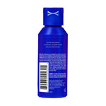 Close up of Harry's blue bottle cap and travel size skincare bottle.