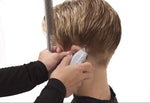 Professional barber using Andis T-Outliner for beard outlining