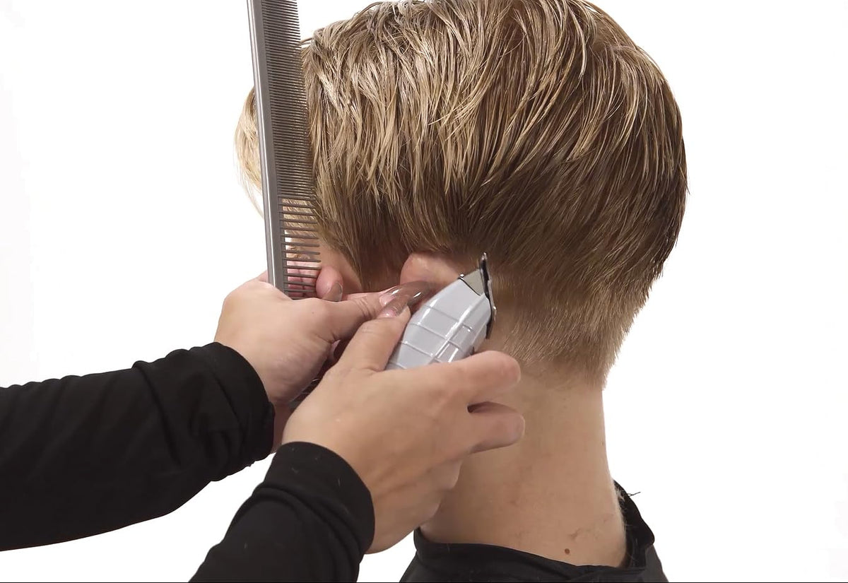 Professional barber using Andis T-Outliner for beard outlining
