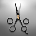 BRV MEN professional grooming shears opened wide to highlight the precise sharp bevel edge.