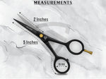 Ergonomic black grooming scissors with comfort finger rings inserted for precision trimming