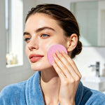 Krgiqn pink face cleansing sponge expanding in water close up view
