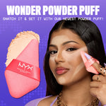 Reusable triangle makeup puff by NYX Cosmetics showing the wide flat setting side