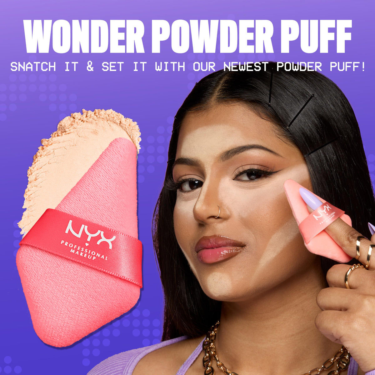 Reusable triangle makeup puff by NYX Cosmetics showing the wide flat setting side