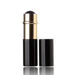 Compact travel kabuki powder brush retracted with its removable gold protective cap
