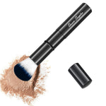Queen Scepter compact kabuki brush placed next to a travel makeup bag