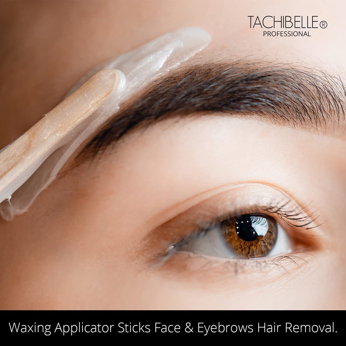 Close up view of the smooth birch wood texture and slanted edges of Tachibelle precision hair removal spatulas.