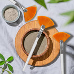 Using the soft fan brush to sweep away makeup eyeshadow fallout under the eye.