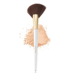 Comparison view of the white angled fan brush next to standard face makeup tools