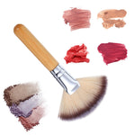 Side angle shot of the dense yet fluffy salbsever fan makeup brush used for highlighting and powder blush blending