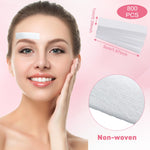 Close up view of individual small white hair removal wax paper sheets