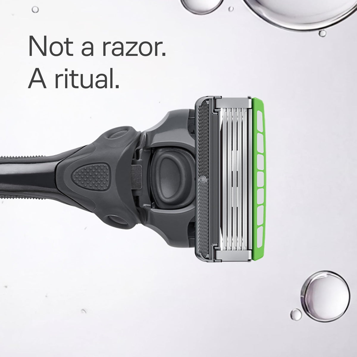 Back angle of the imported grooming cartridges showing the protective skin guards on each blade